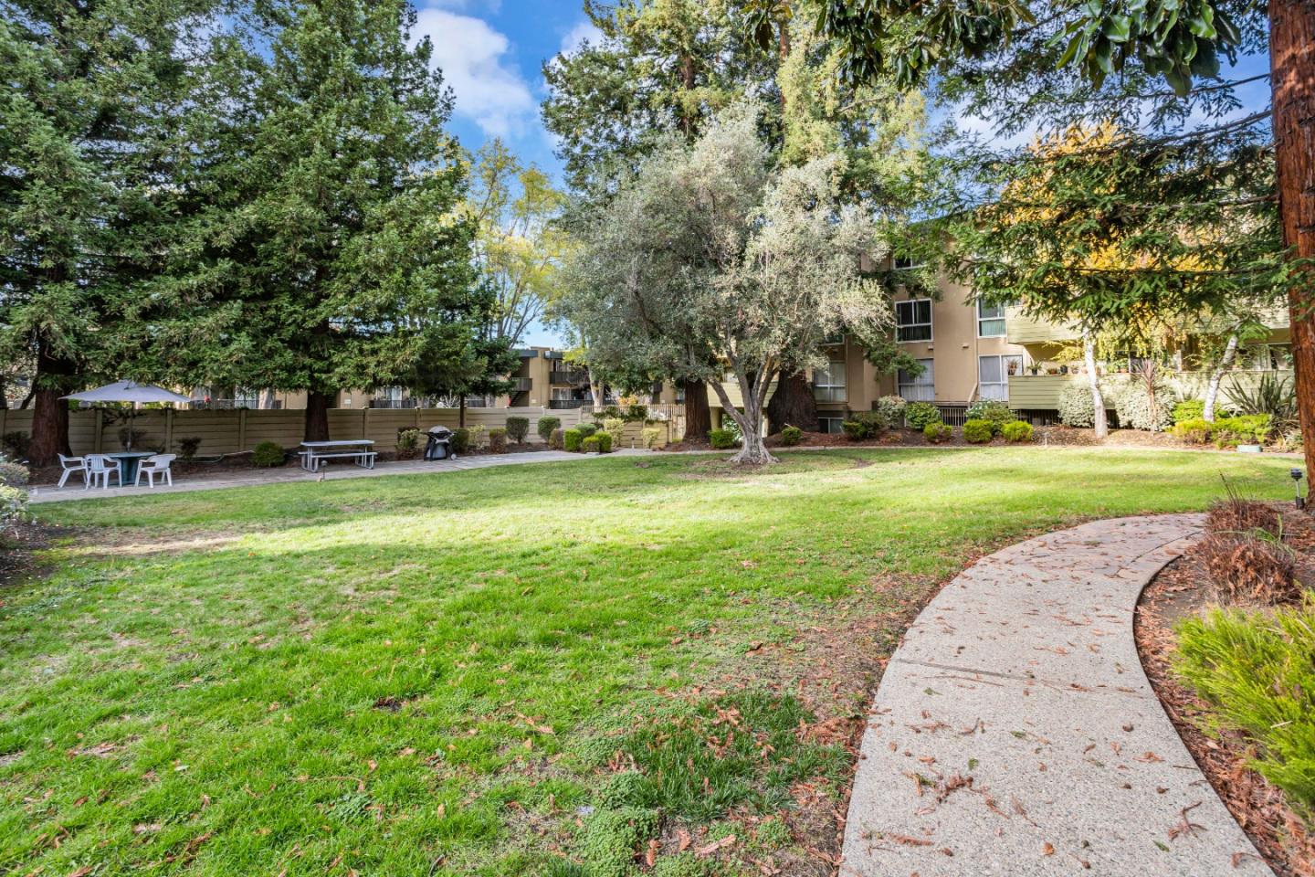 1033 Crestview Drive, Unit 309 Mountain View, CA 94040 - Photo 44 of 50 front view of a building with a yard