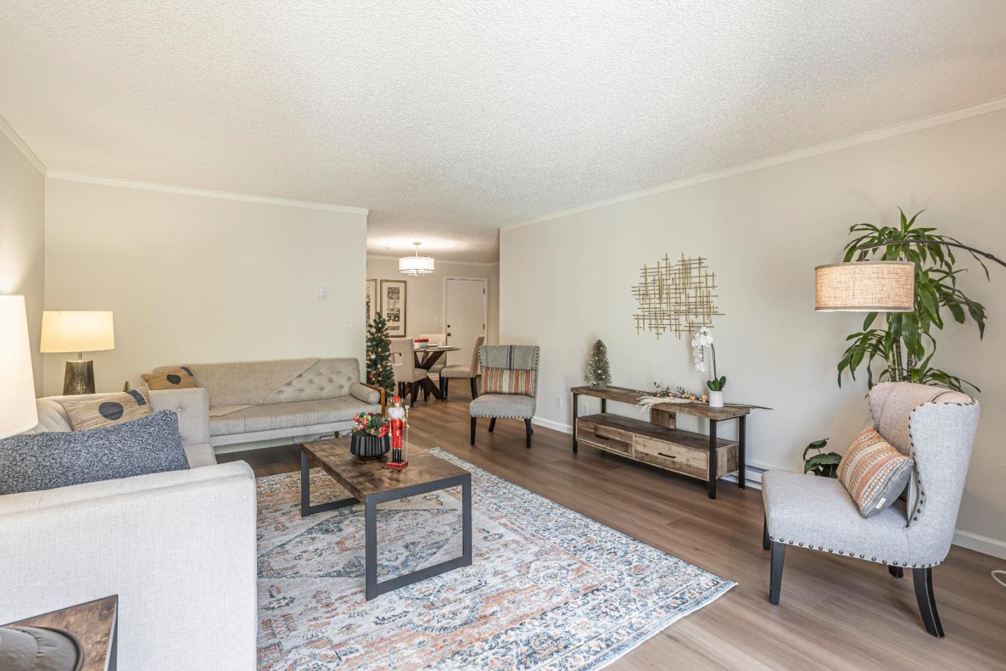 1033 Crestview Drive, Unit 309 Mountain View, CA 94040 - Photo 6 of 50 a living room with furniture and a rug