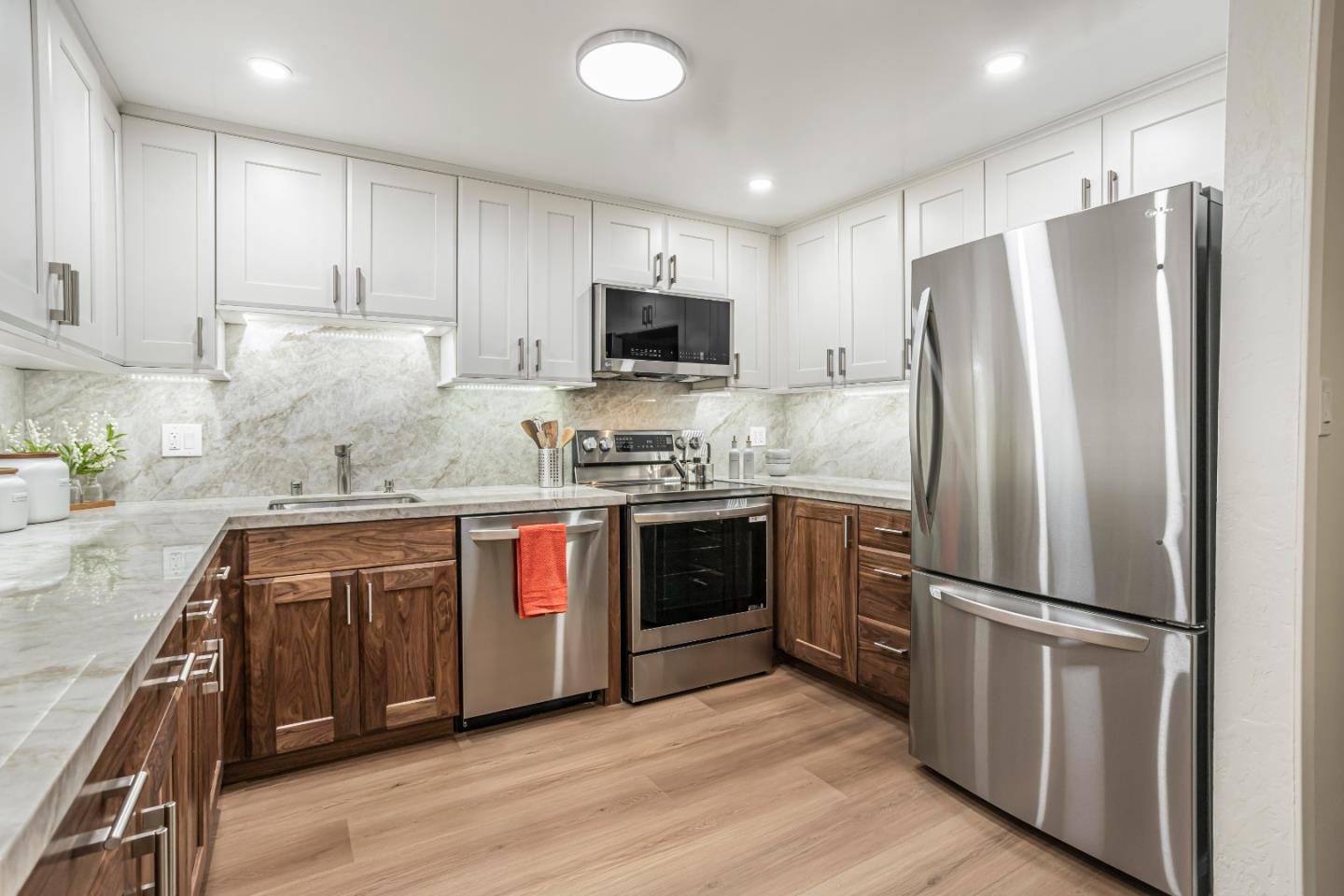 1033 Crestview Drive, Unit 309 Mountain View, CA 94040 - Photo 7 of 50 a kitchen with stainless steel appliances granite countertop a refrigerator stove and sink
