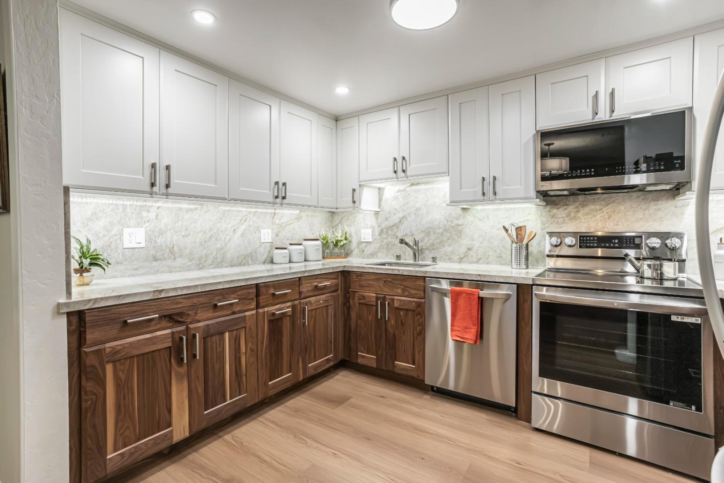 1033 Crestview Drive, Unit 309 Mountain View, CA 94040 - Photo 8 of 50 a kitchen with stainless steel appliances granite countertop a stove and a sink