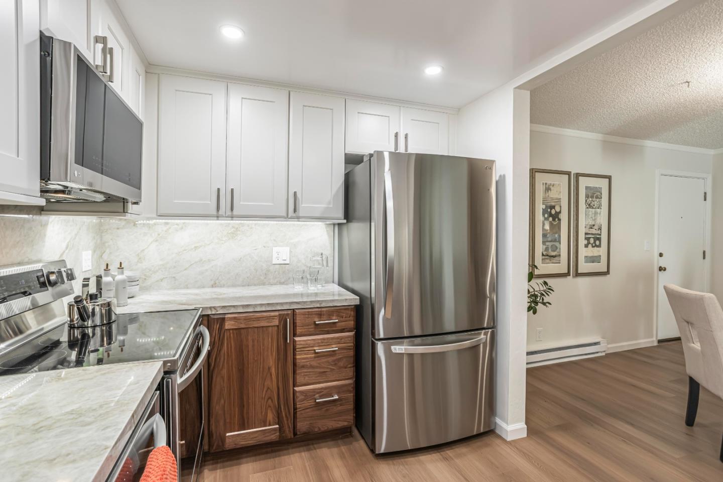 1033 Crestview Drive, Unit 309 Mountain View, CA 94040 - Photo 9 of 50 a kitchen with stainless steel appliances granite countertop a refrigerator and a sink