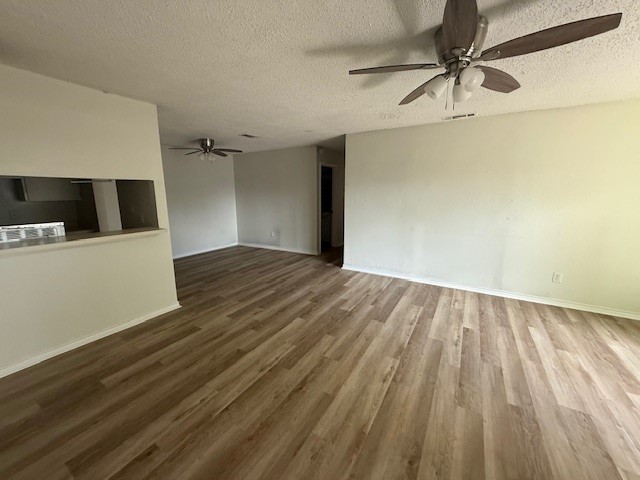 4217 I-69 Access Road, Unit 2 Corpus Christi, TX 78410 - Photo 2 of 14 a view of empty room with wooden floor and fan