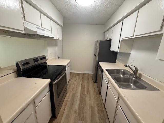 4217 I-69 Access Road, Unit 2 Corpus Christi, TX 78410 - Photo 4 of 14 a kitchen that has a sink and a stove