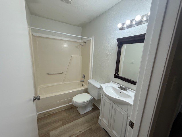 4217 I-69 Access Road, Unit 2 Corpus Christi, TX 78410 - Photo 5 of 14 a bathroom with a toilet a sink and a mirror