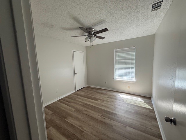 4217 I-69 Access Road, Unit 2 Corpus Christi, TX 78410 - Photo 8 of 14 wooden floor in an empty room with a window