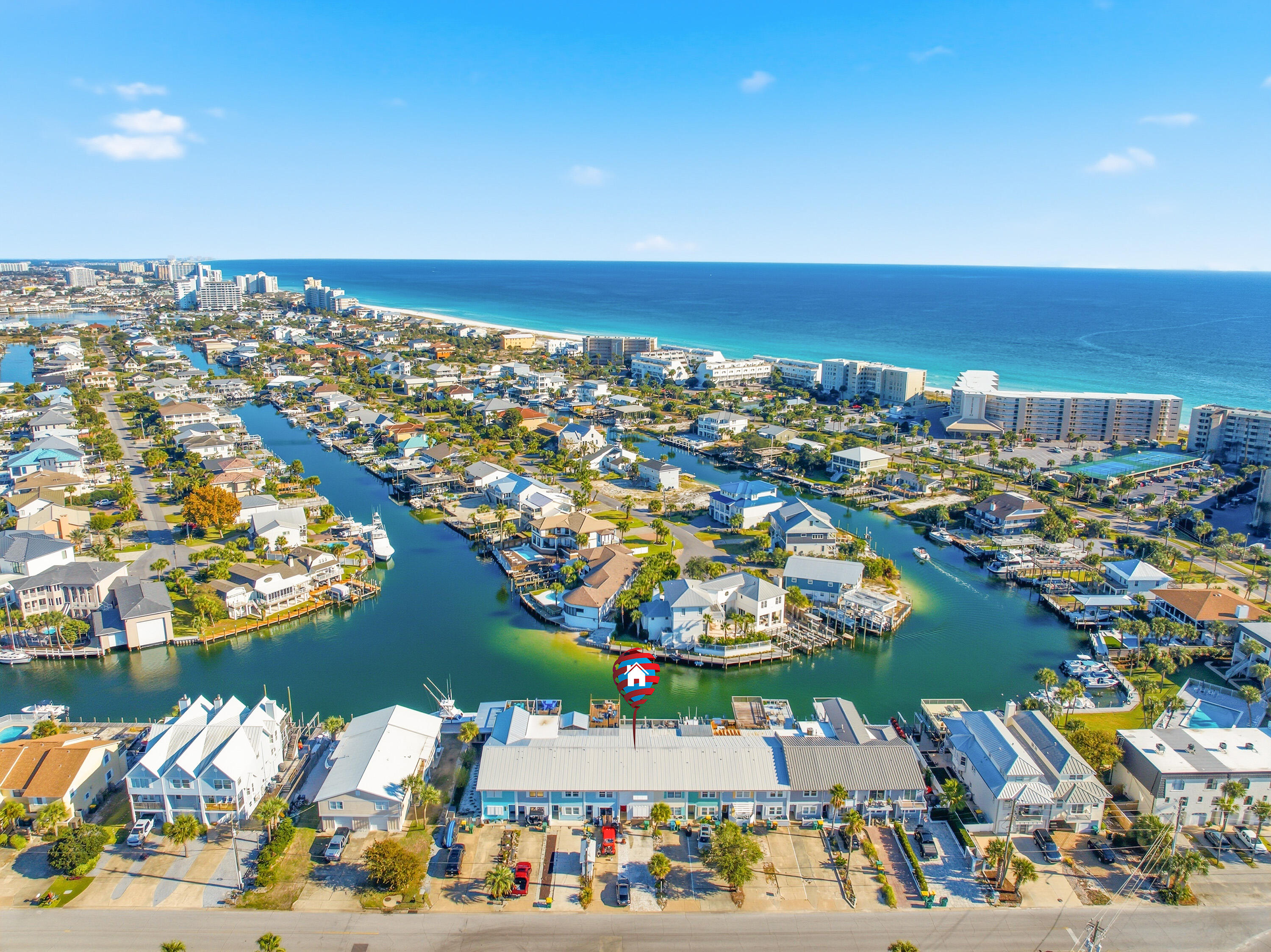 an aerial view of a city with lots of residential buildings lake and ocean view