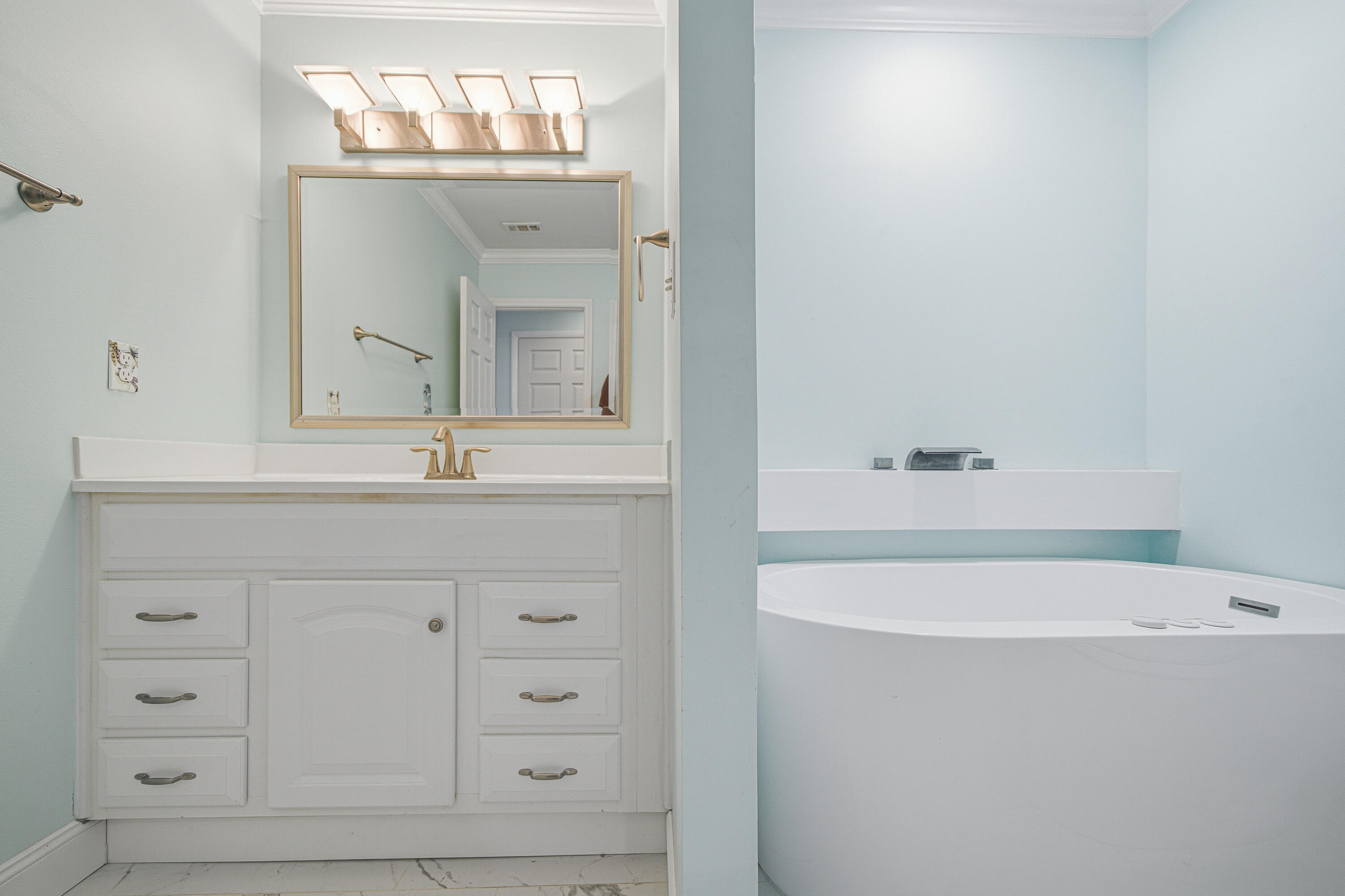 125 Durango Road Destin, FL 32541 - Photo 14 of 63 a bathroom with a bathtub sink and mirror