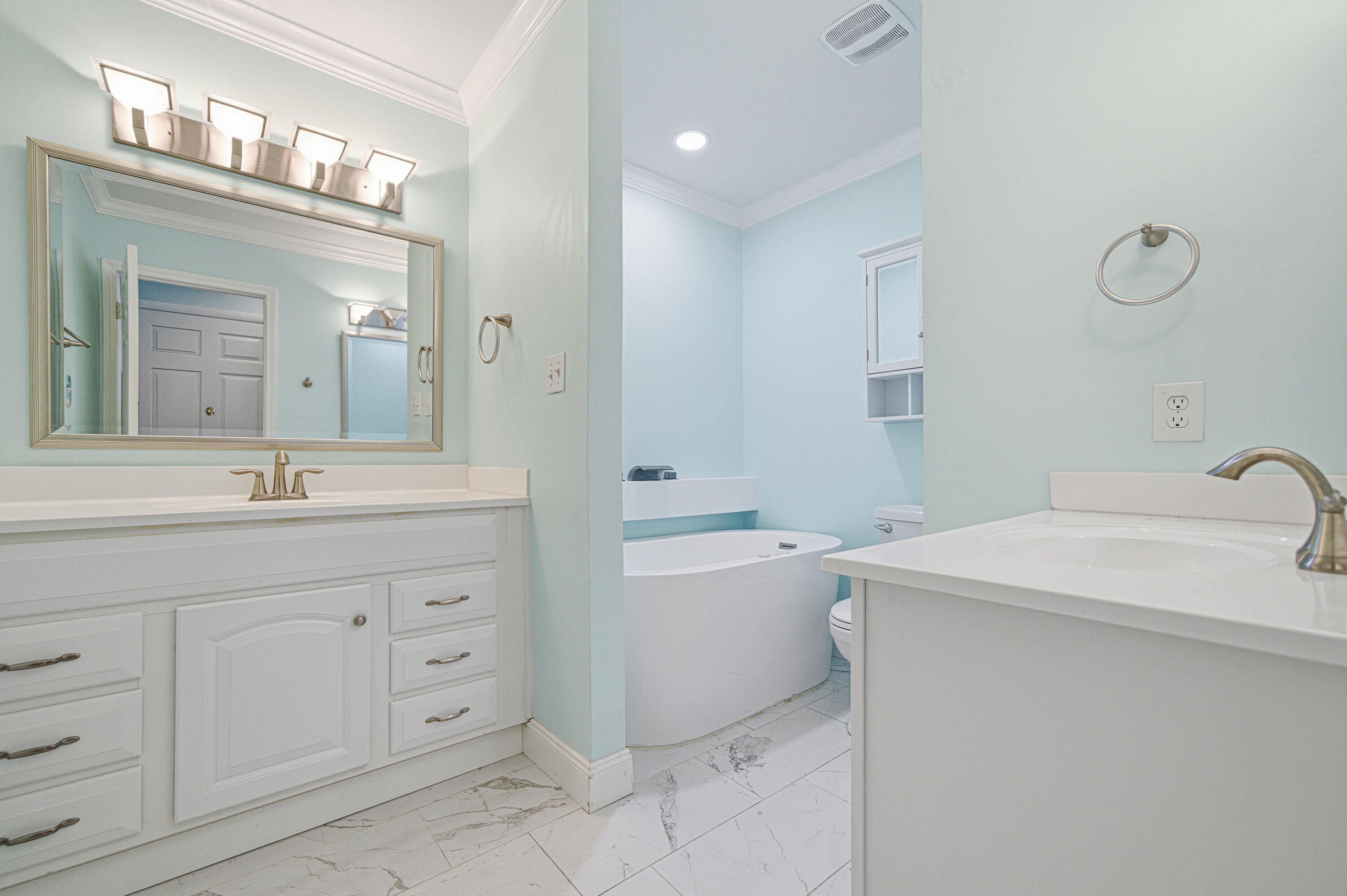 125 Durango Road Destin, FL 32541 - Photo 16 of 63 a bathroom with a sink a toilet and a mirror