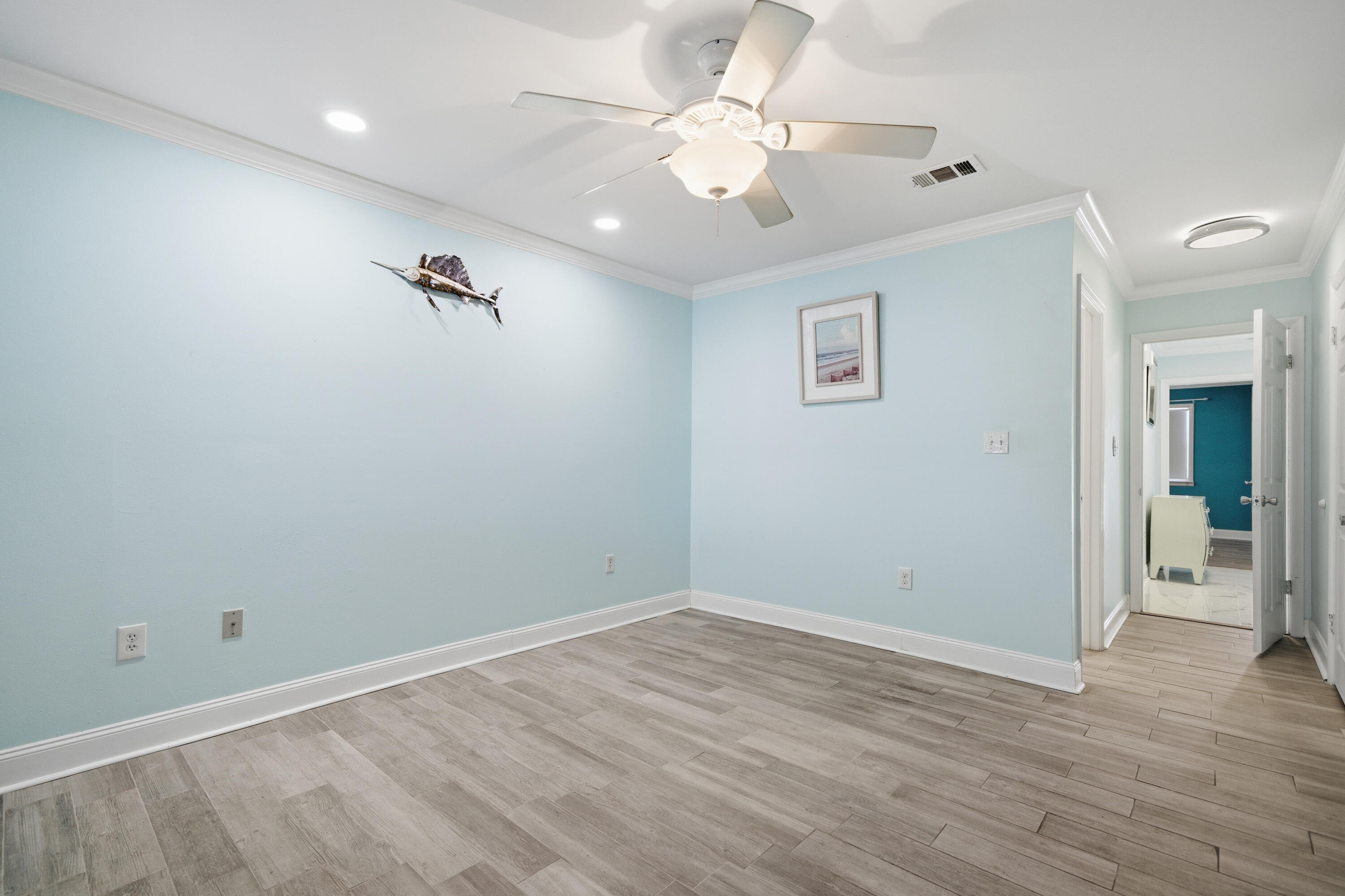 125 Durango Road Destin, FL 32541 - Photo 22 of 63 wooden floor in an empty room with a window
