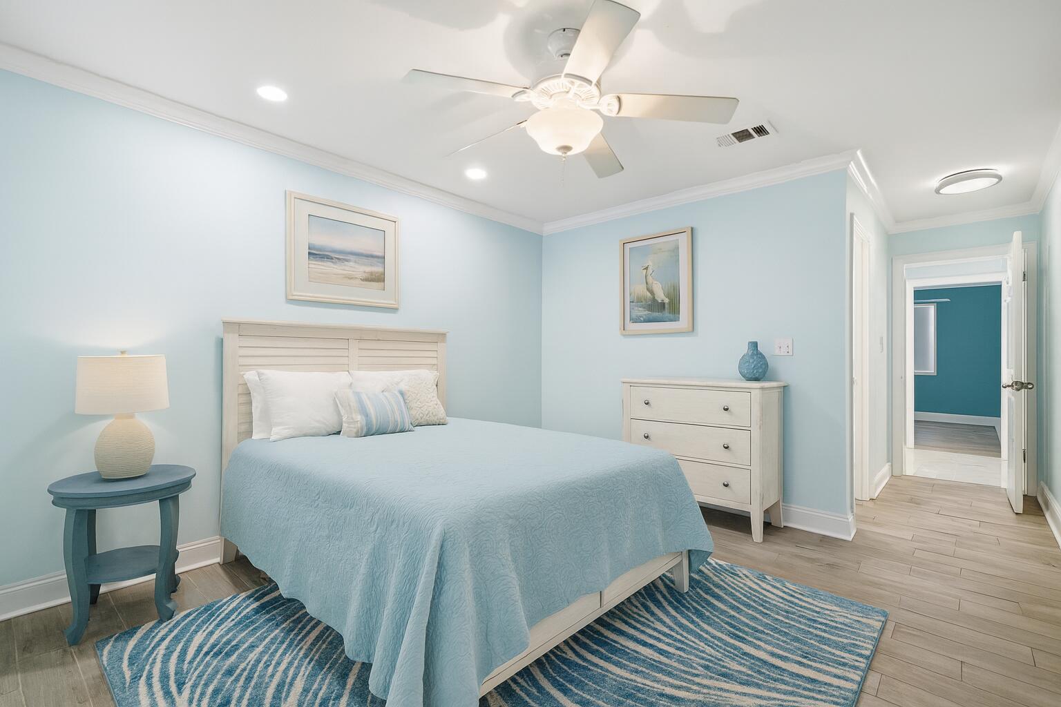 125 Durango Road Destin, FL 32541 - Photo 23 of 63 a bedroom with a bed and a lamp on dresser