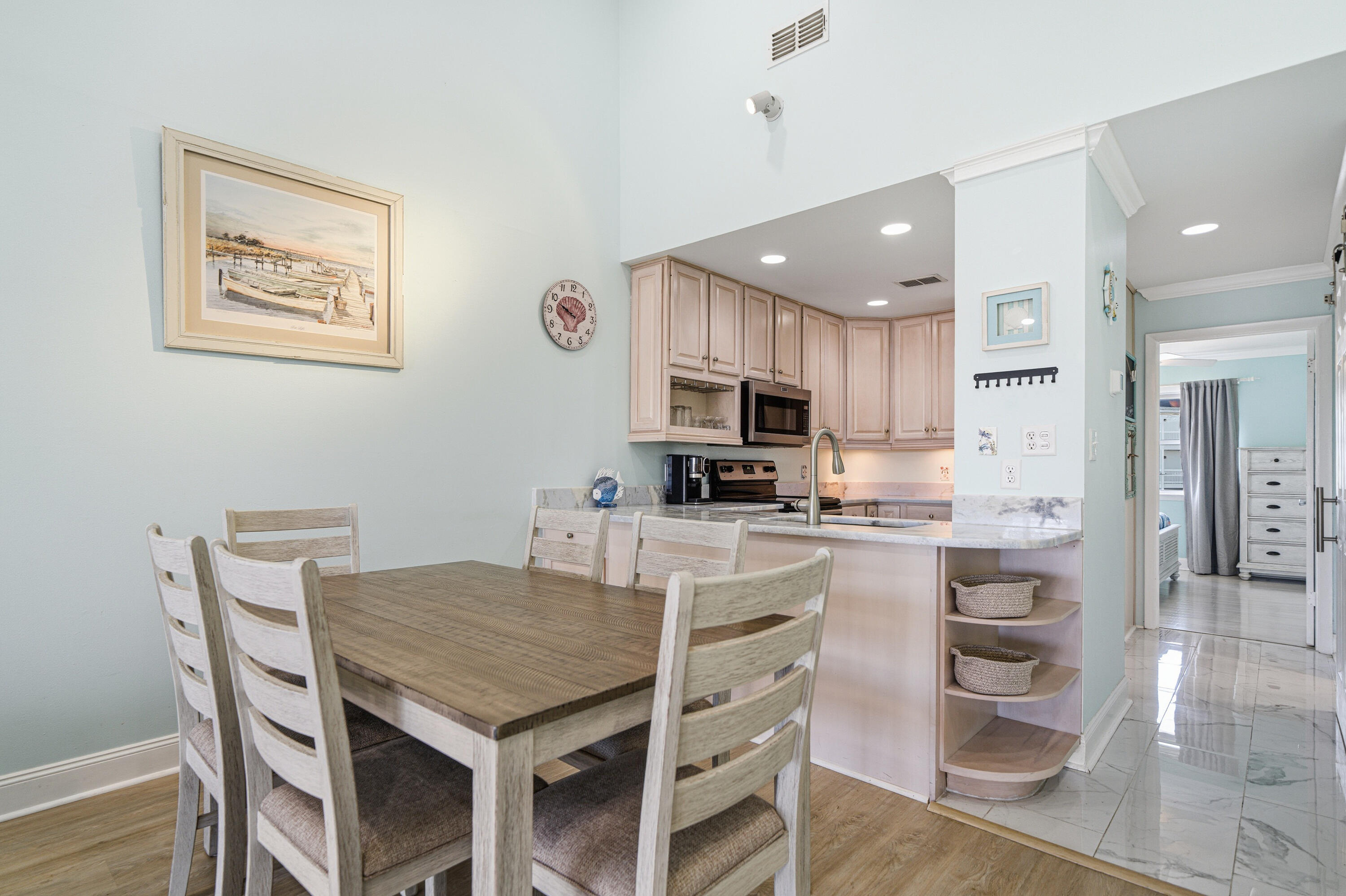 125 Durango Road Destin, FL 32541 - Photo 38 of 63 a kitchen with a table and chairs in it