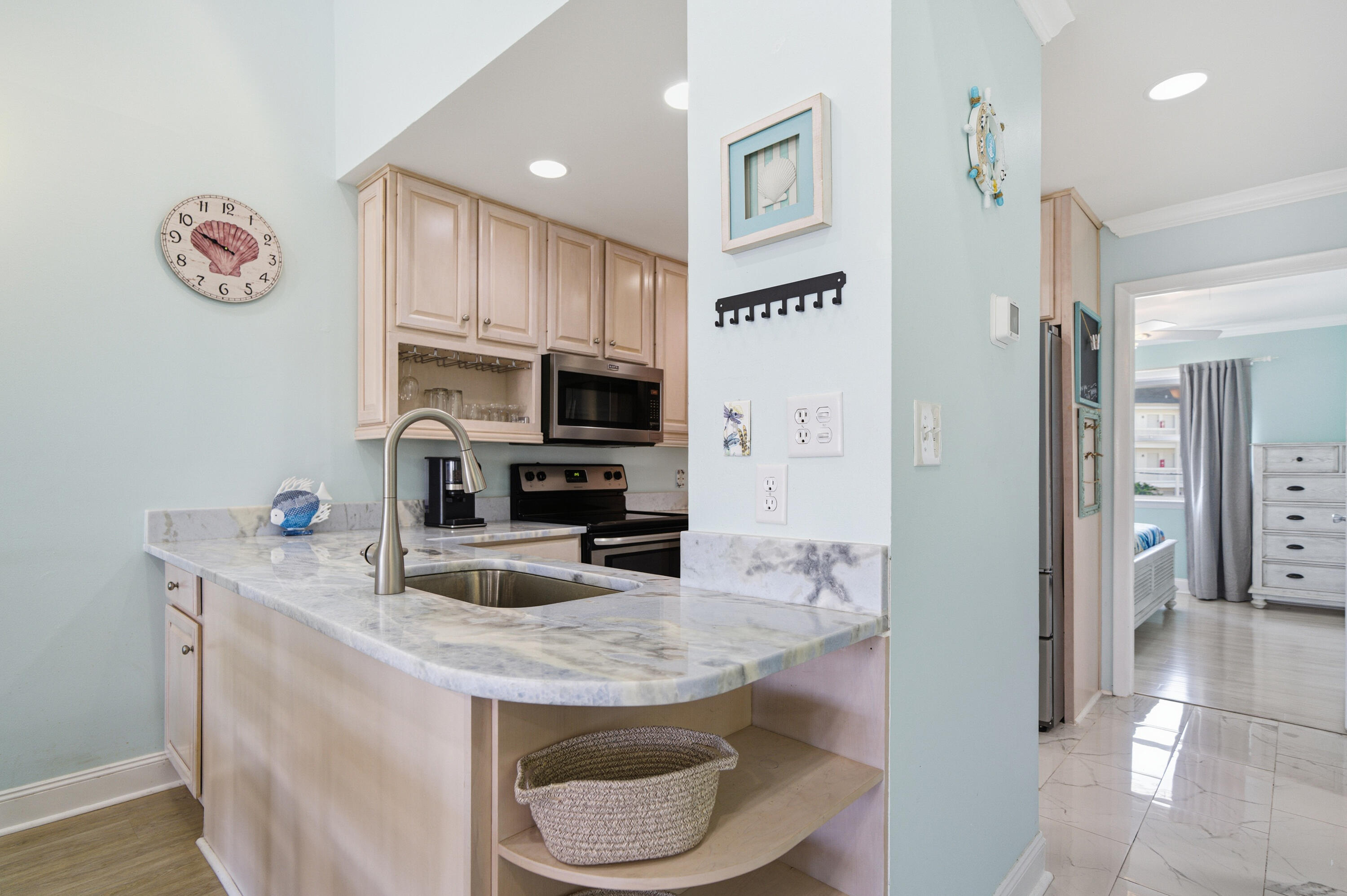 125 Durango Road Destin, FL 32541 - Photo 39 of 63 a kitchen with granite countertop a refrigerator a stove and a sink