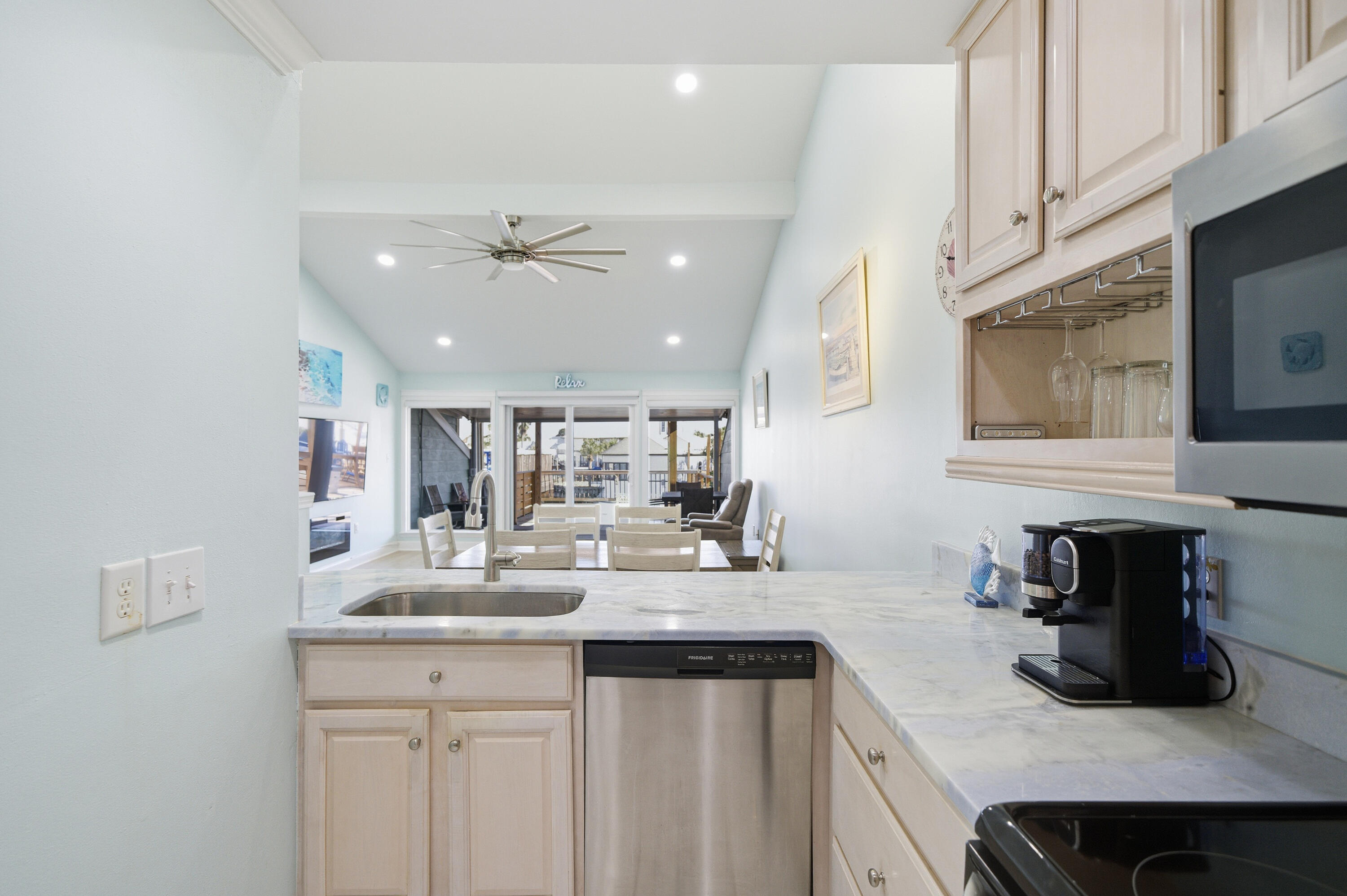 125 Durango Road Destin, FL 32541 - Photo 42 of 63 a kitchen with a sink a stove and cabinets