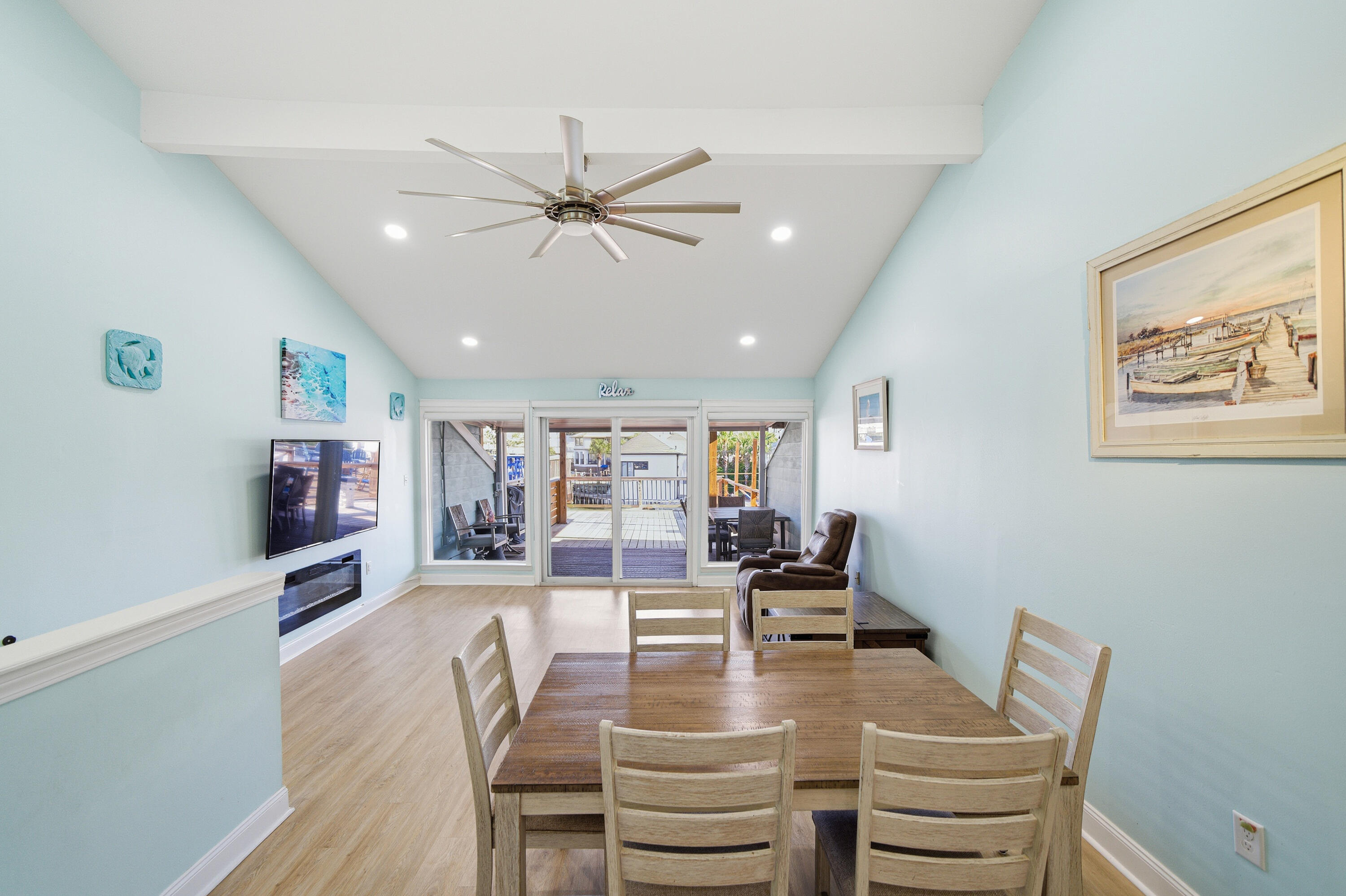 125 Durango Road Destin, FL 32541 - Photo 43 of 63 a view of a dining room with furniture a chandelier and wooden floor
