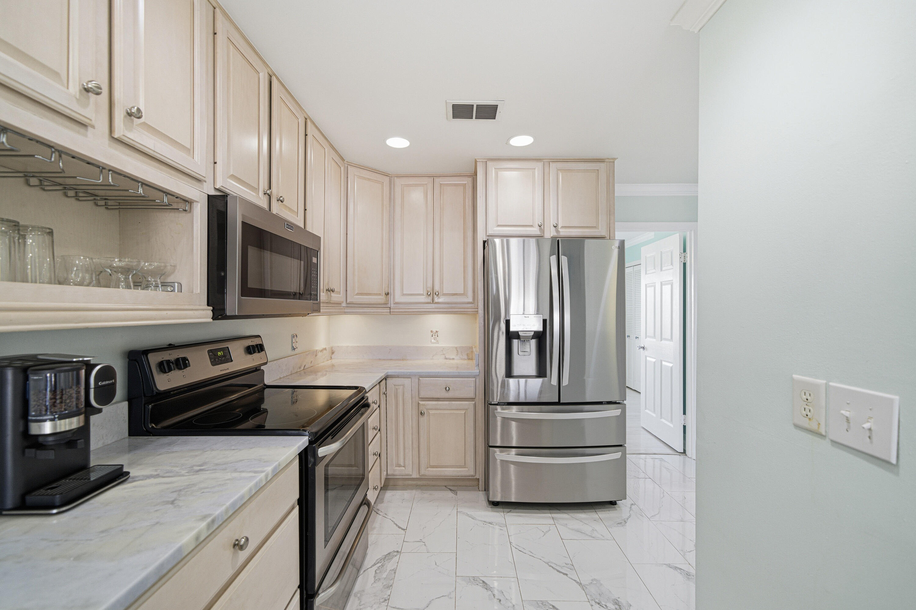 125 Durango Road Destin, FL 32541 - Photo 44 of 63 a kitchen with stainless steel appliances granite countertop a refrigerator and a stove