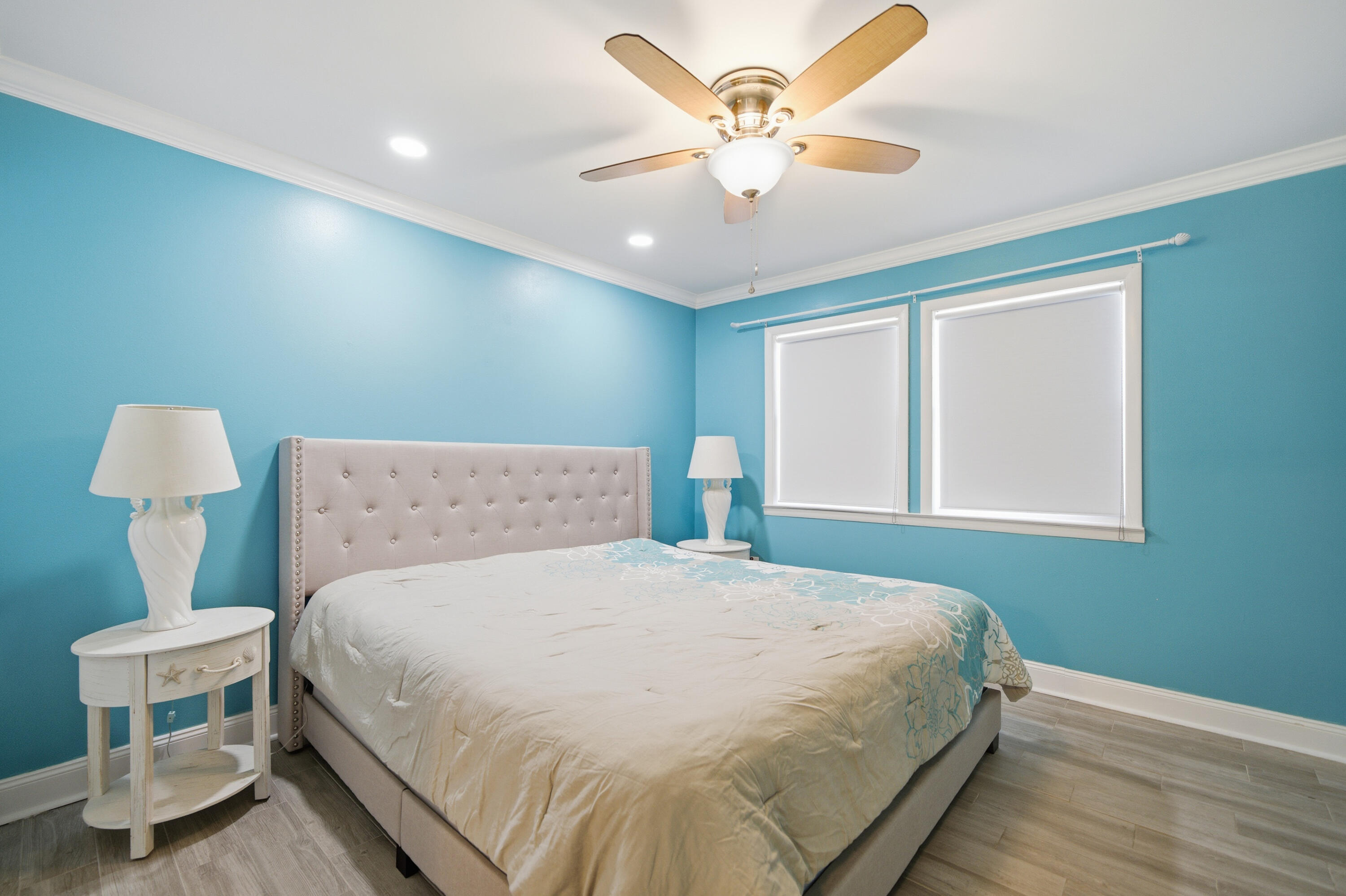 125 Durango Road Destin, FL 32541 - Photo 7 of 63 a bedroom with a large bed and a chandelier