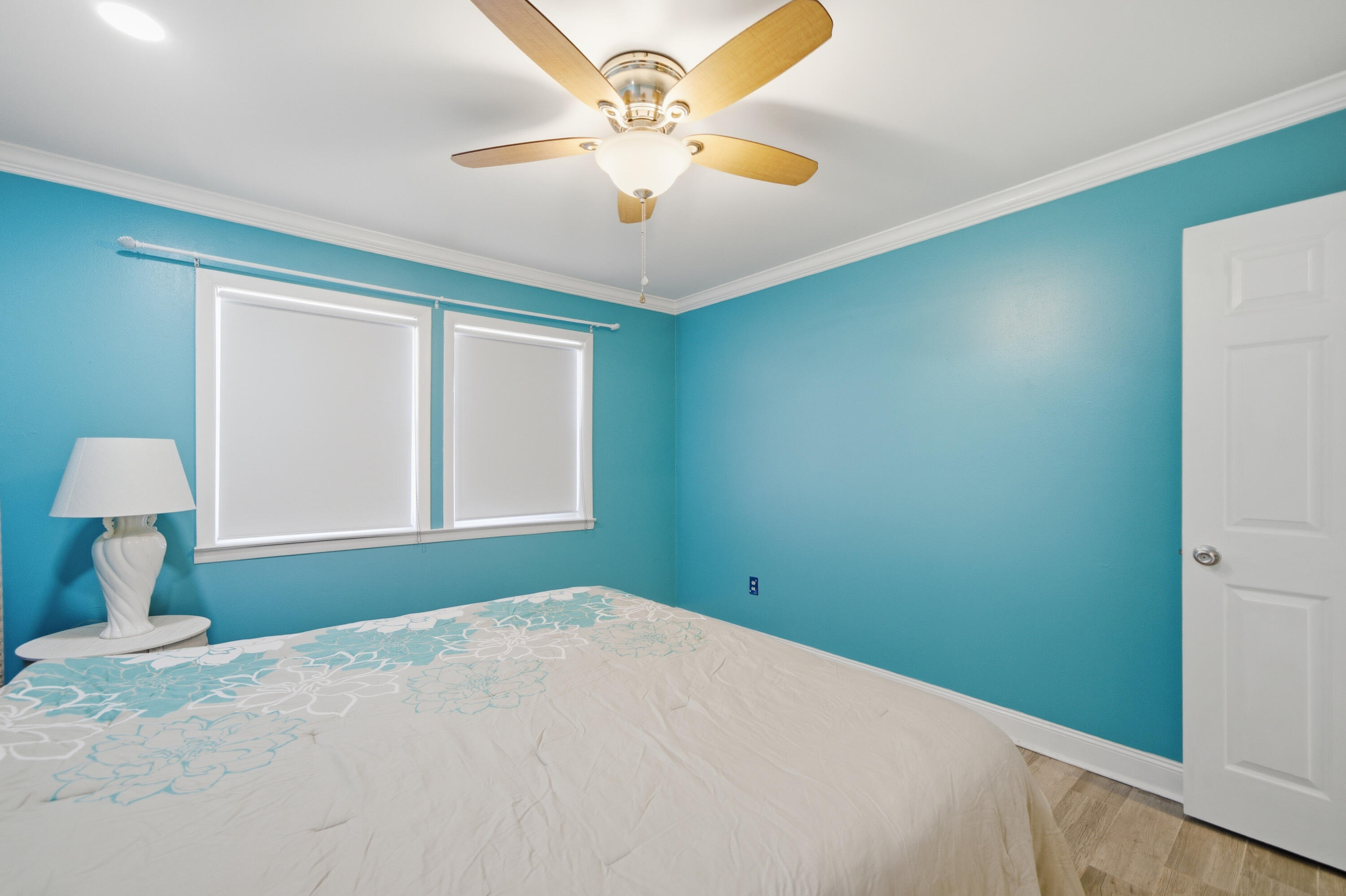 125 Durango Road Destin, FL 32541 - Photo 8 of 63 a bedroom with a bed and a chandelier