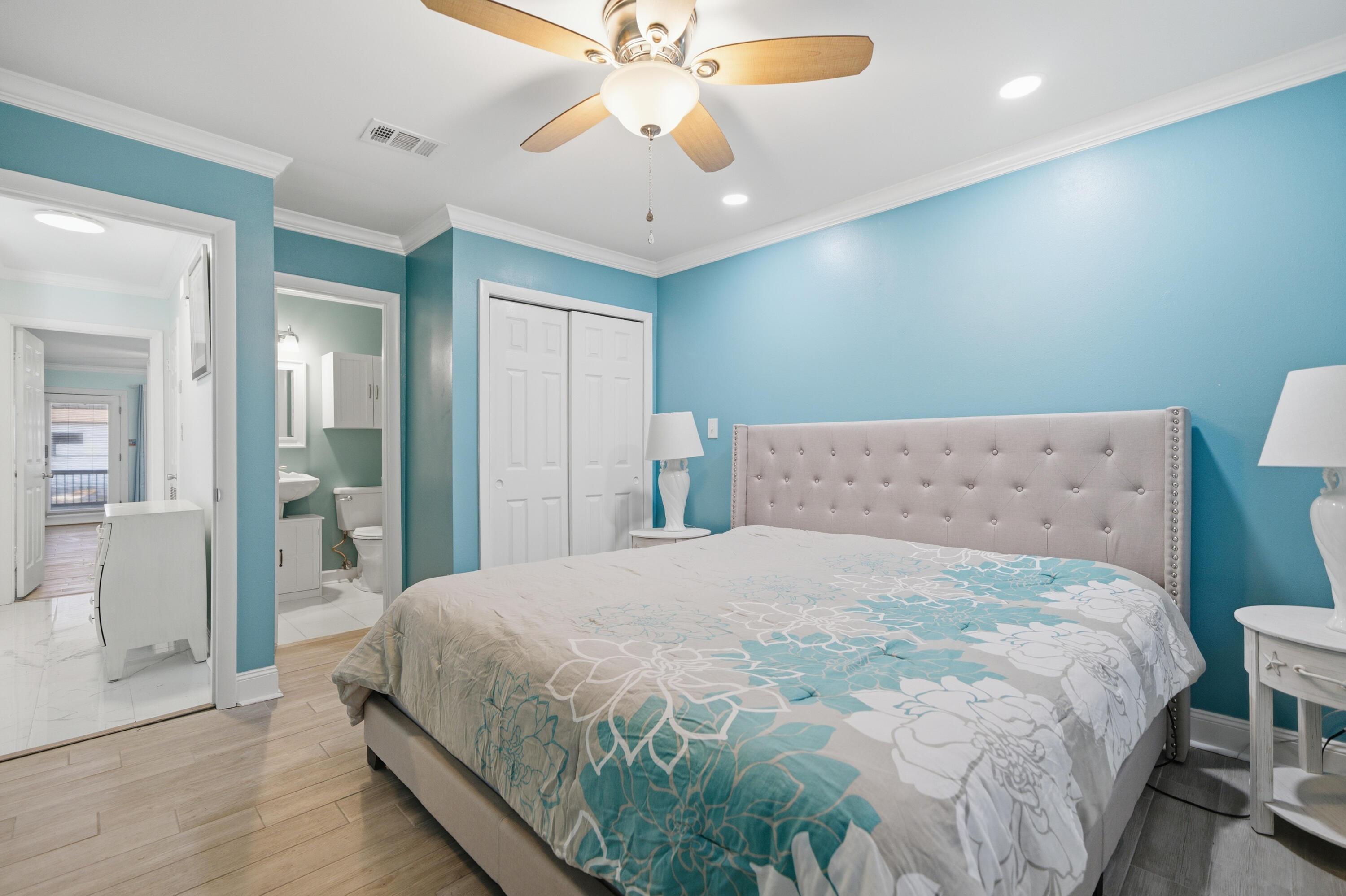 125 Durango Road Destin, FL 32541 - Photo 9 of 63 a large bed sitting in a bedroom and a chandelier