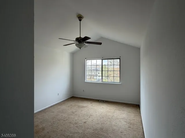 a view of empty room with windows