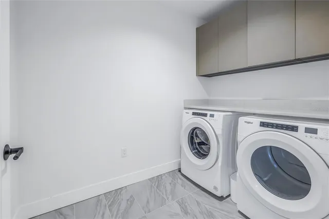 a view of a swimming pool with outdoor seating