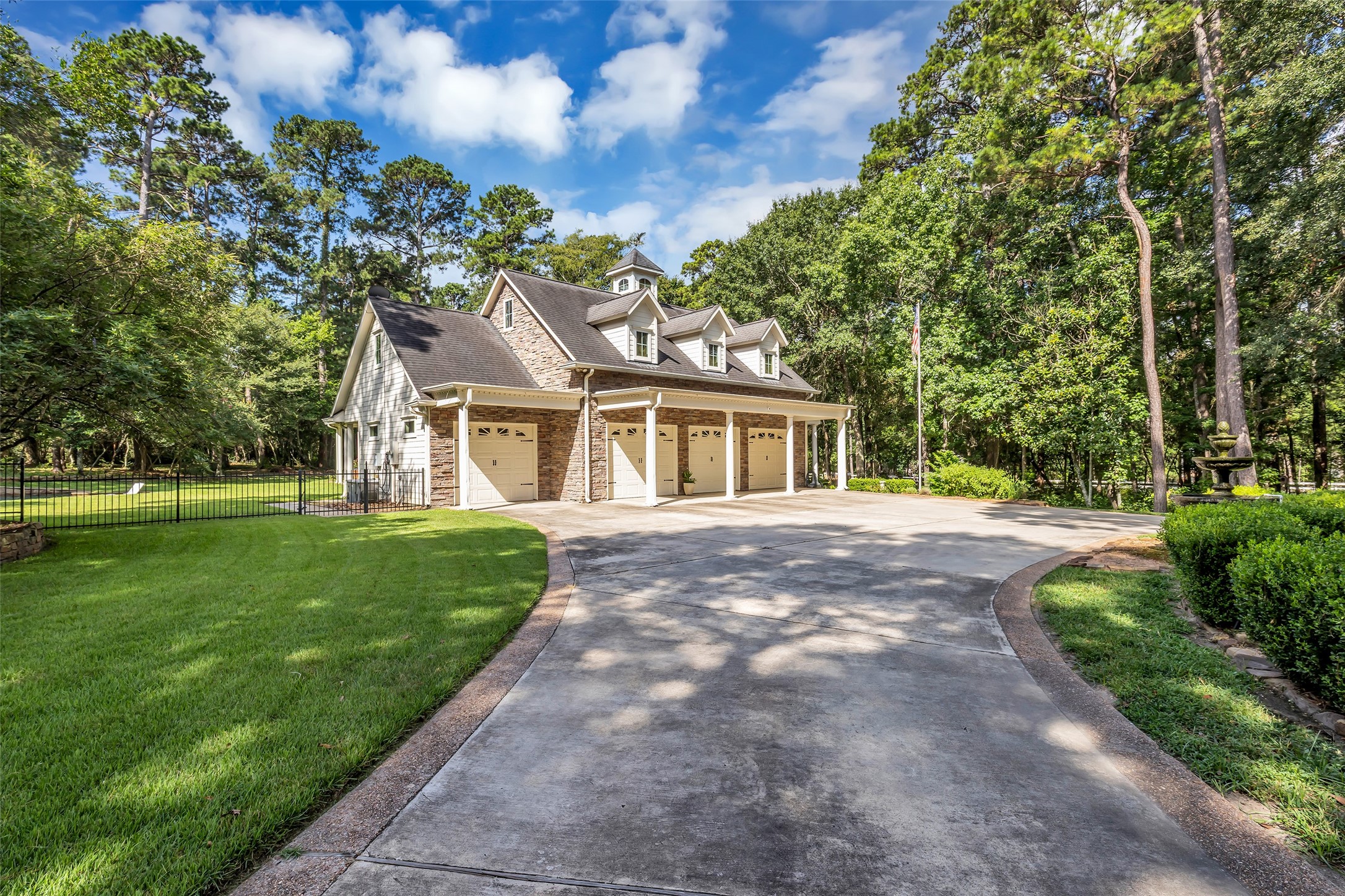 10478 River Ridge Lane Conroe, TX 77304 - Photo 8 of 50 Four car garage, one of the bays is climate controlled