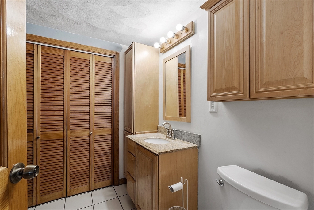 5 Elizabeth Road Billerica, MA 01821 - Photo 12 of 41 a bathroom with a sink a toilet and shower