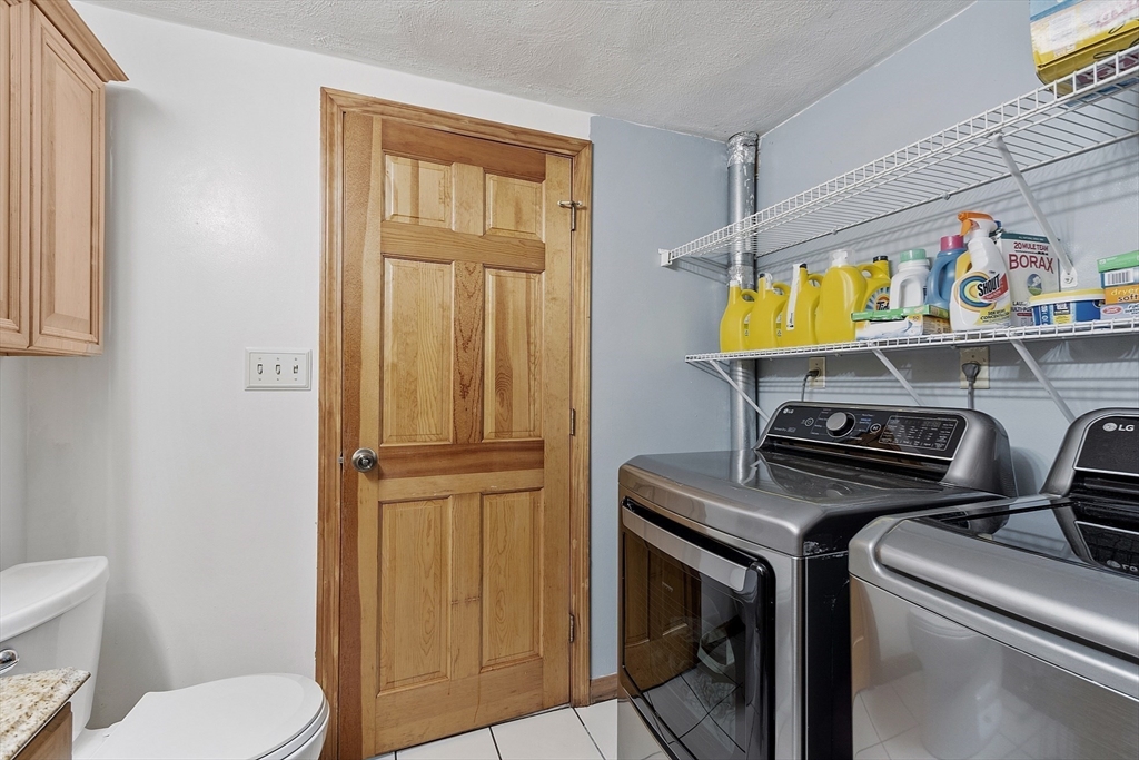 5 Elizabeth Road Billerica, MA 01821 - Photo 13 of 41 a utility room with dryer and washer