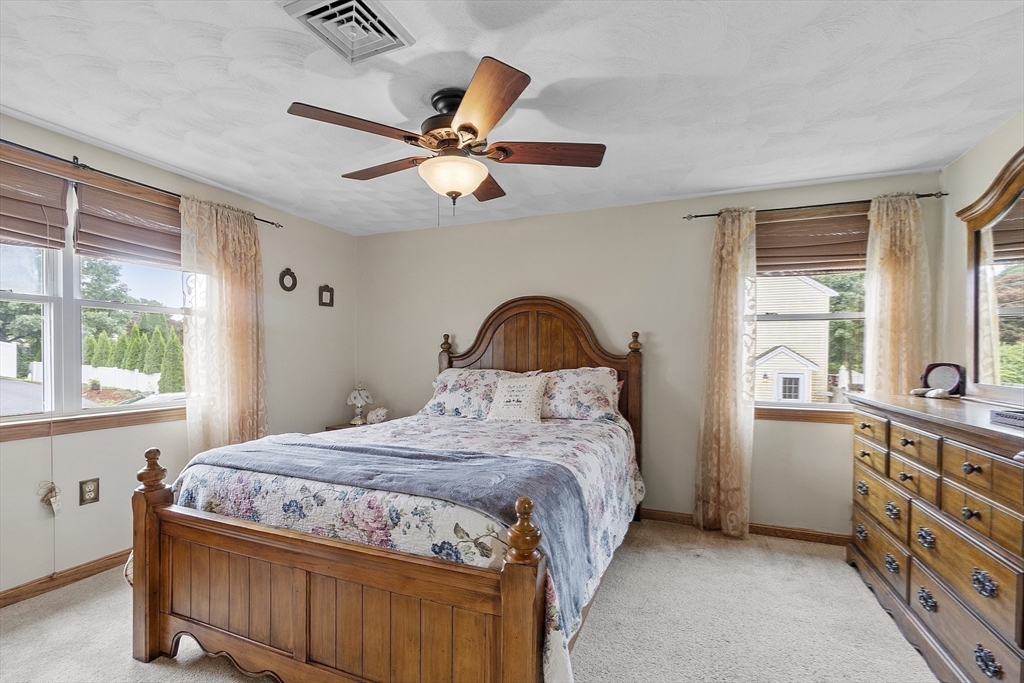 5 Elizabeth Road Billerica, MA 01821 - Photo 15 of 41 a bedroom with a bed and a large window