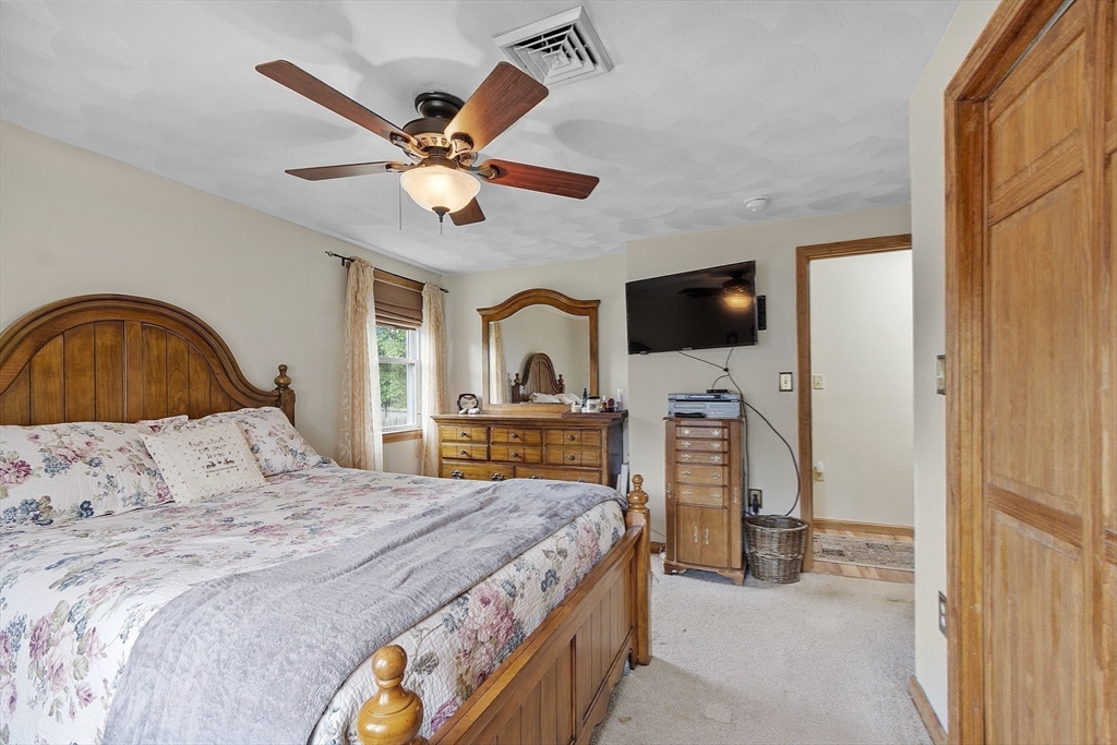 5 Elizabeth Road Billerica, MA 01821 - Photo 16 of 41 a bedroom with a bed and a flat screen tv