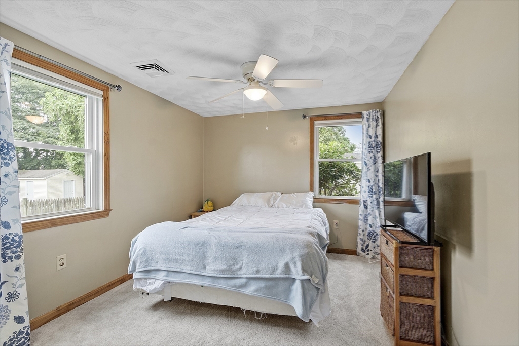 5 Elizabeth Road Billerica, MA 01821 - Photo 18 of 41 a bedroom with a bed tv and a window