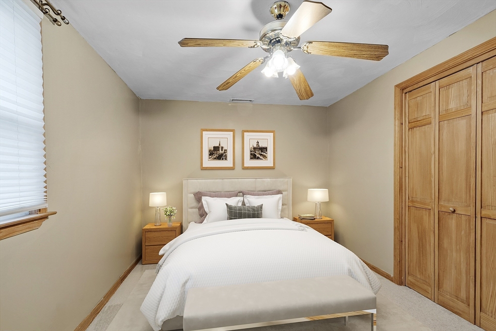 5 Elizabeth Road Billerica, MA 01821 - Photo 20 of 41 a bedroom with a large bed and a chandelier