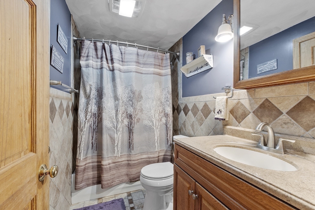 5 Elizabeth Road Billerica, MA 01821 - Photo 26 of 41 a bathroom with a granite countertop sink toilet and shower