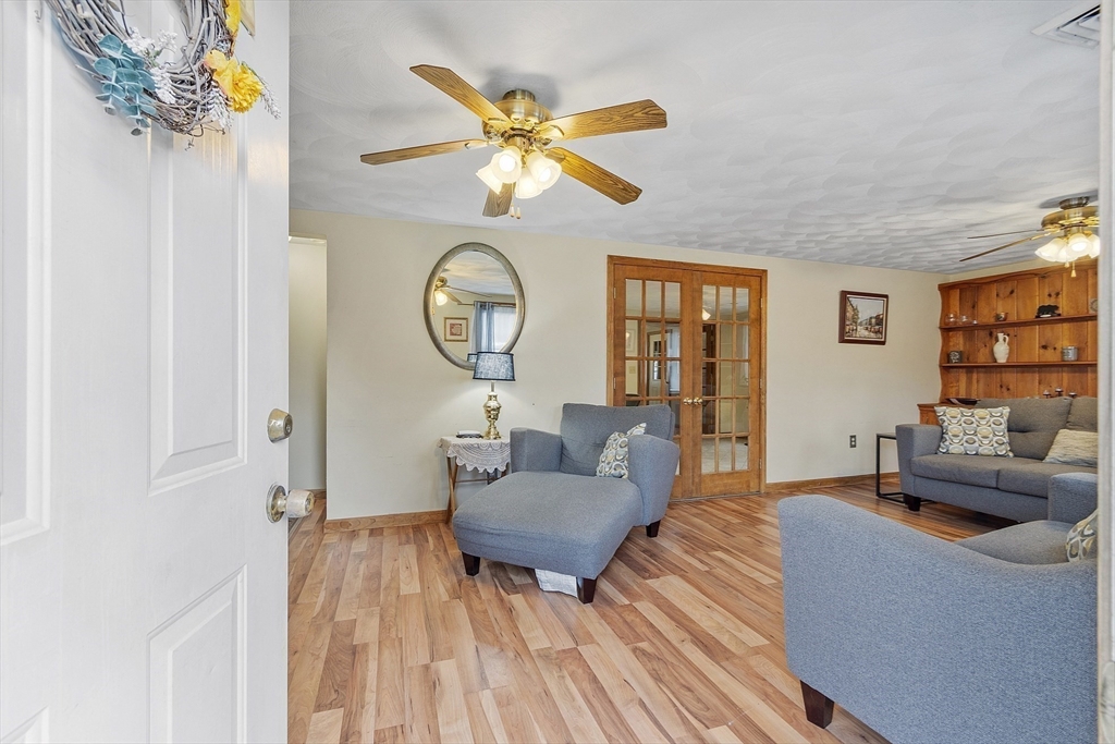 5 Elizabeth Road Billerica, MA 01821 - Photo 3 of 41 a living room with furniture and a wooden floor