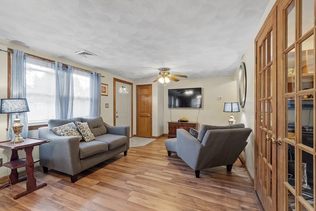 5 Elizabeth Road Billerica, MA 01821 - Photo 5 of 41 a living room with furniture and a flat screen tv