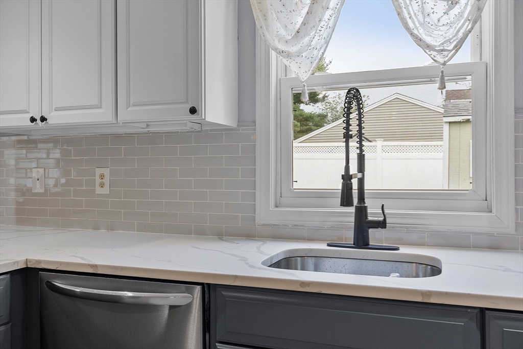 5 Elizabeth Road Billerica, MA 01821 - Photo 10 of 41 a kitchen with a sink and a window