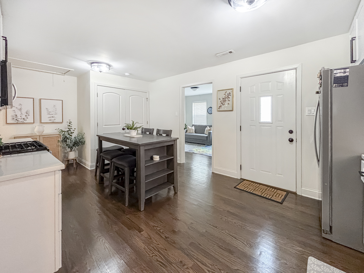 8538 45th Street Lyons, IL 60534 - Photo 14 of 29 a living room with stainless steel appliances kitchen island hardwood floor and a refrigerator