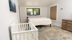 387 Enfield Street Boca Raton, FL 33487 - Photo 11 of 37 a bedroom with a bed and a dresser
