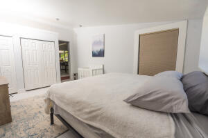 387 Enfield Street Boca Raton, FL 33487 - Photo 12 of 37 a bedroom with a bed and a closet