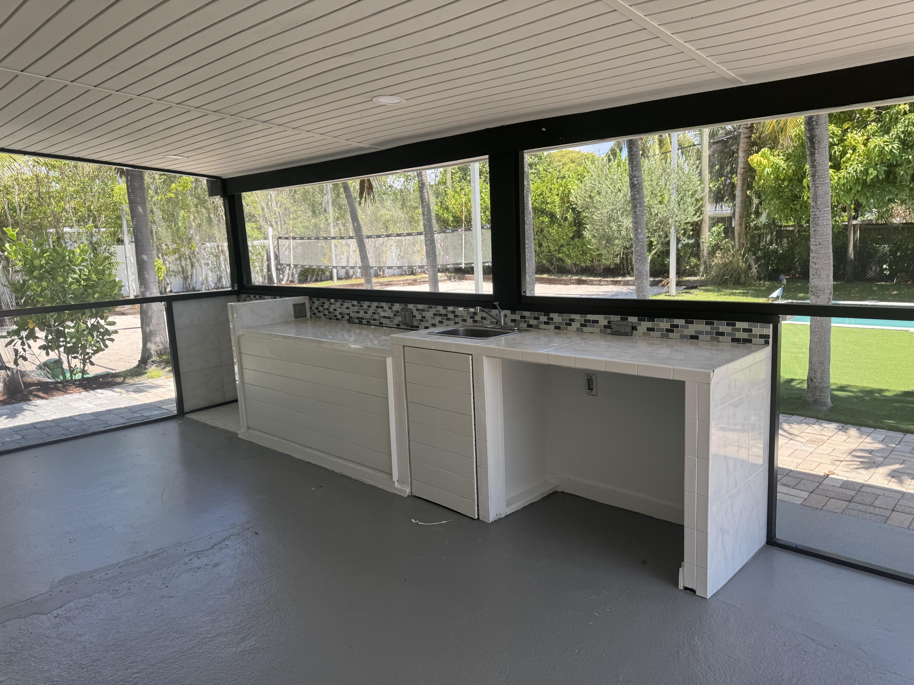 387 Enfield Street Boca Raton, FL 33487 - Photo 16 of 37 a kitchen with a large window