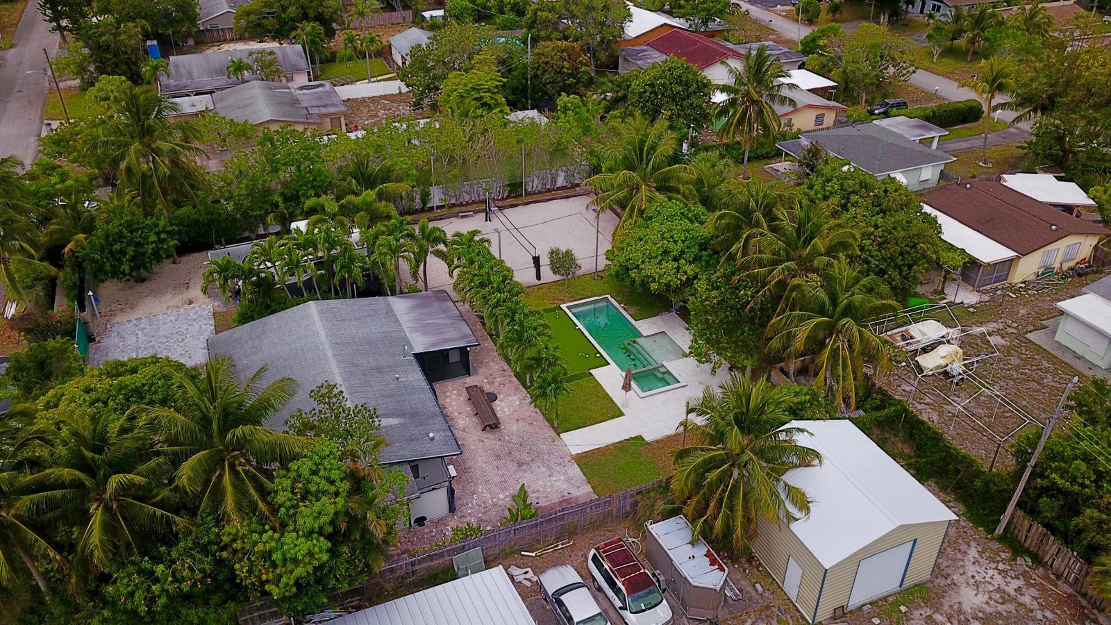 387 Enfield Street Boca Raton, FL 33487 - Photo 29 of 37 an aerial view of a house with a yard