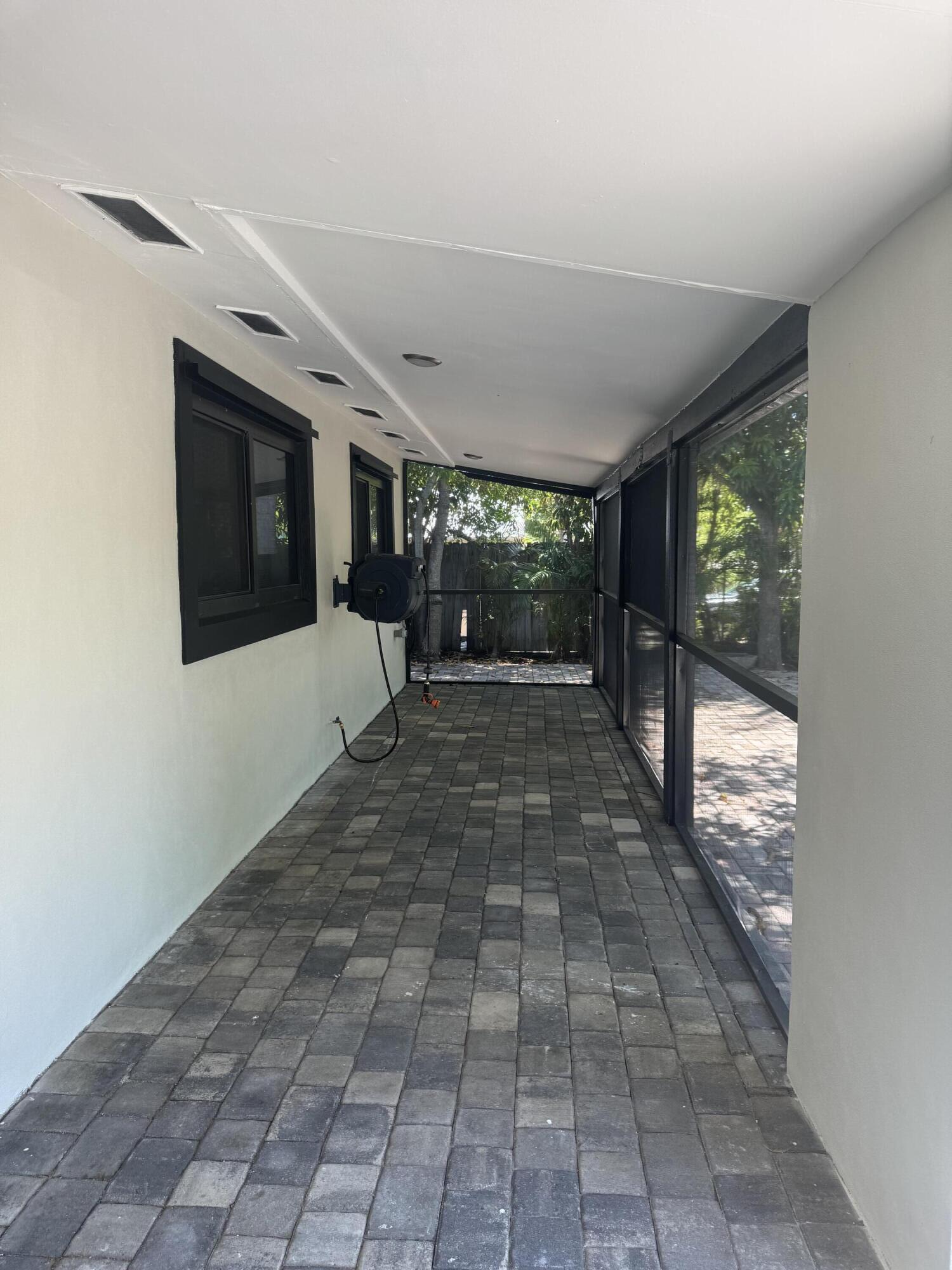 387 Enfield Street Boca Raton, FL 33487 - Photo 3 of 37 a view of a entryway door of the house