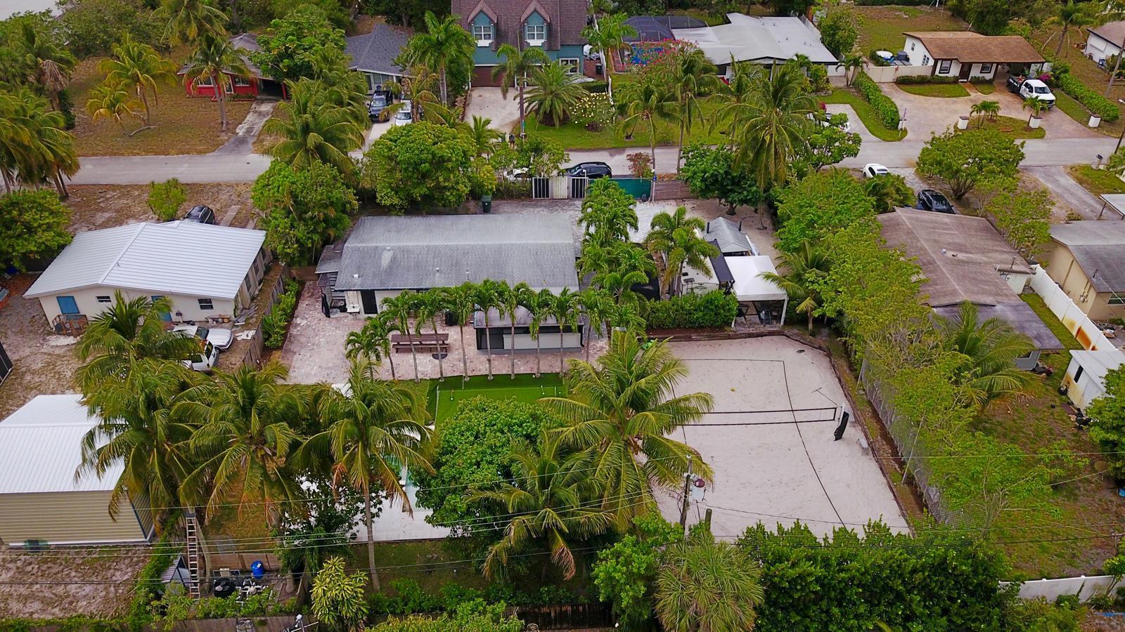 387 Enfield Street Boca Raton, FL 33487 - Photo 31 of 37 an aerial view of a house with a yard and garden