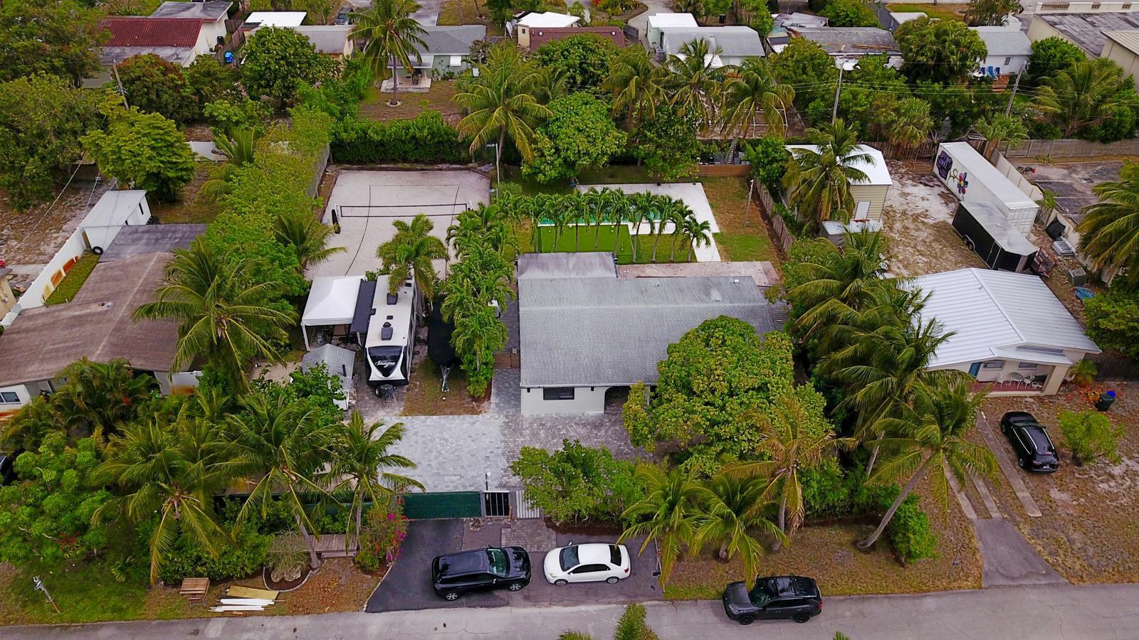 387 Enfield Street Boca Raton, FL 33487 - Photo 33 of 37 an aerial view of houses with yard