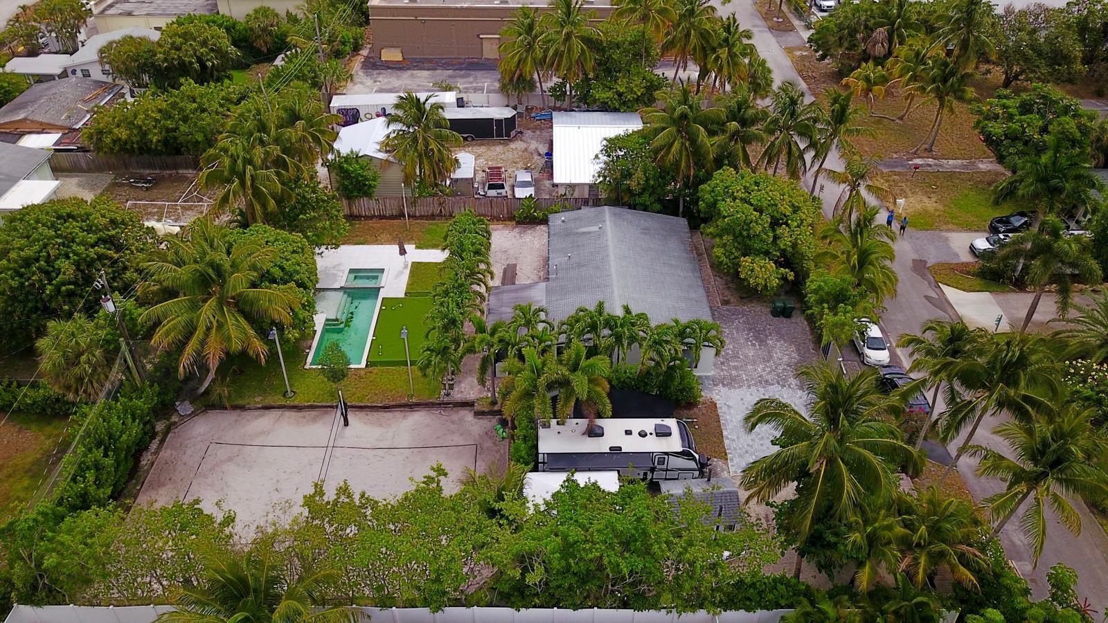 387 Enfield Street Boca Raton, FL 33487 - Photo 36 of 37 an aerial view of a house with a yard and garden