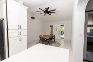 387 Enfield Street Boca Raton, FL 33487 - Photo 6 of 37 a living room with furniture a window and a flat screen tv