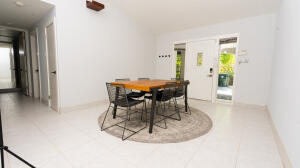 387 Enfield Street Boca Raton, FL 33487 - Photo 8 of 37 a view of a dining room with furniture and a window