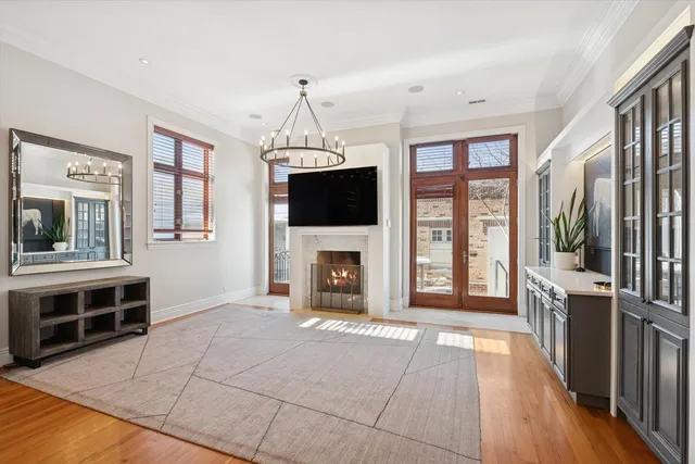 a view of a livingroom with a fireplace and window