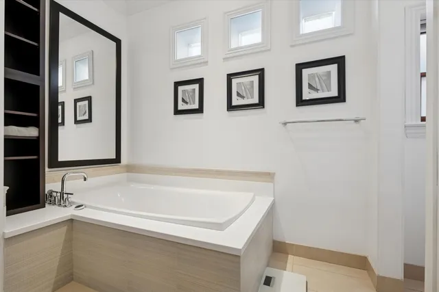 a bathroom with shower and bathtub