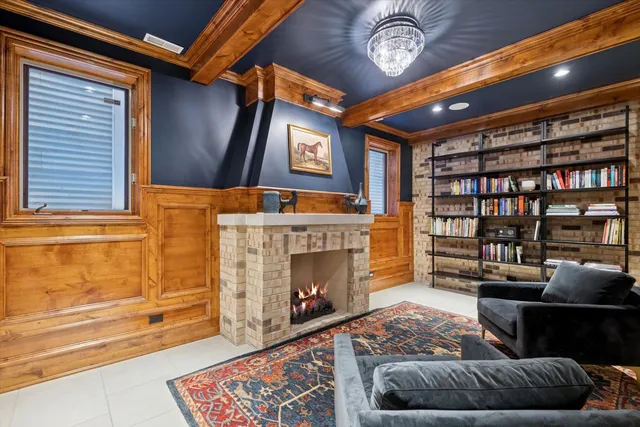 a living room with furniture a fireplace and a rug