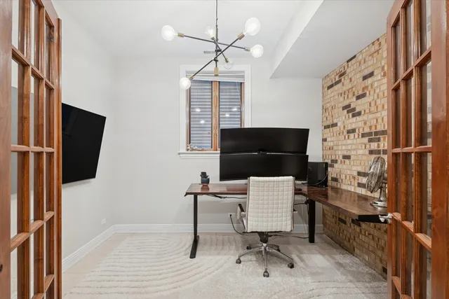 a workspace with furniture and a window